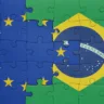 puzzle with the colourful national flag of brazil and flag of european union. concept